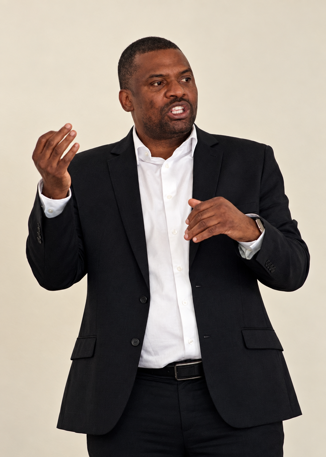 Bertie Kangoya speaking and gesturing during a presentation